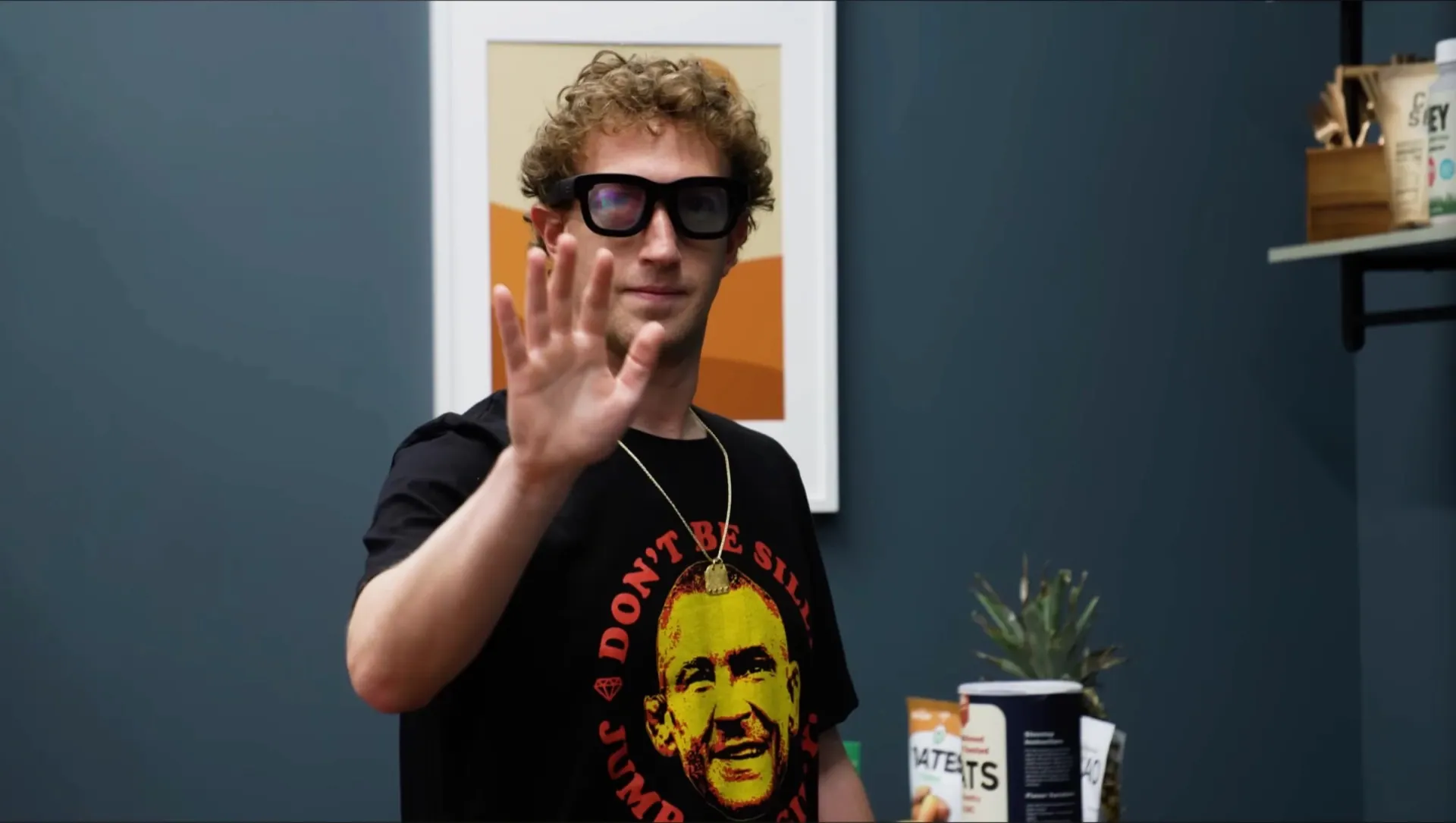 Mark Zuckerberg gesturing while wearing Meta's Orion AR glasses